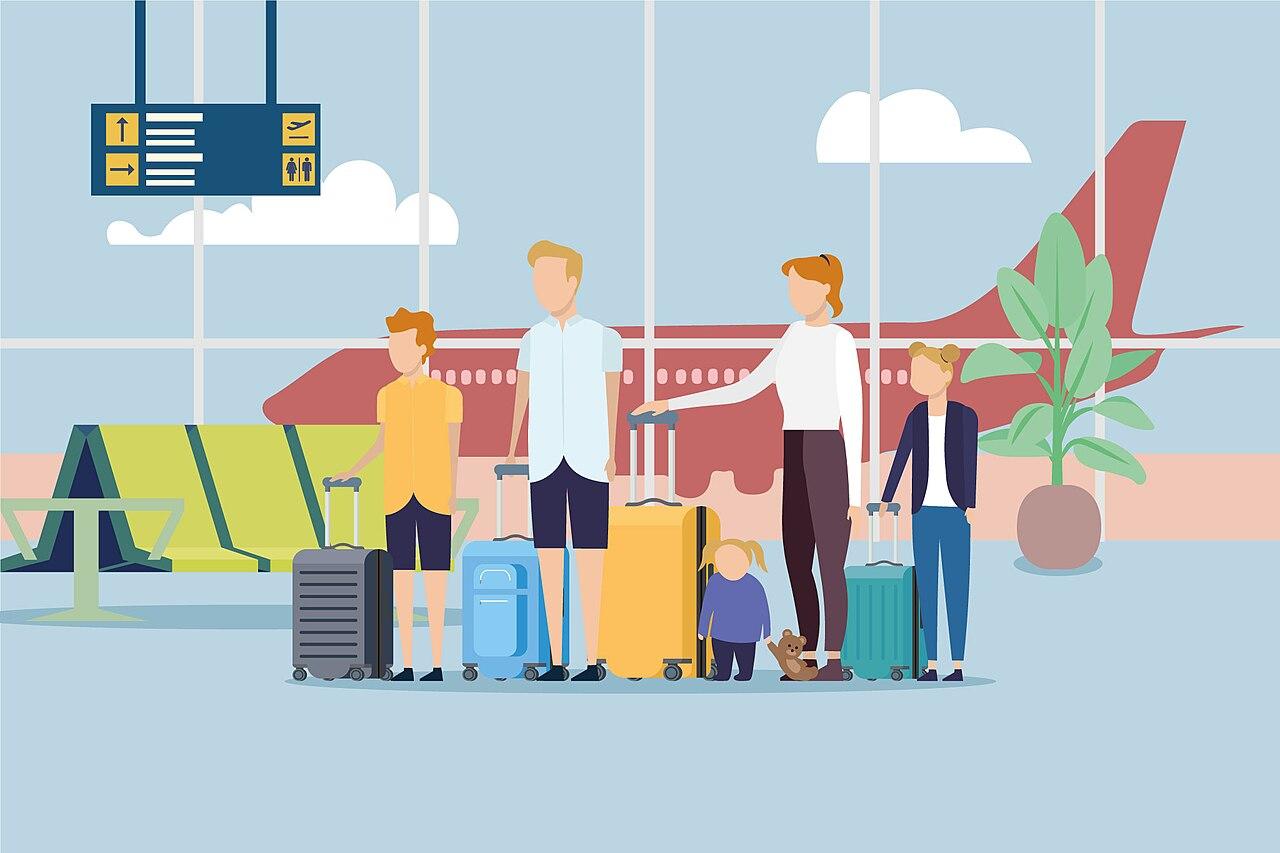Family waiting with luggage at an airport