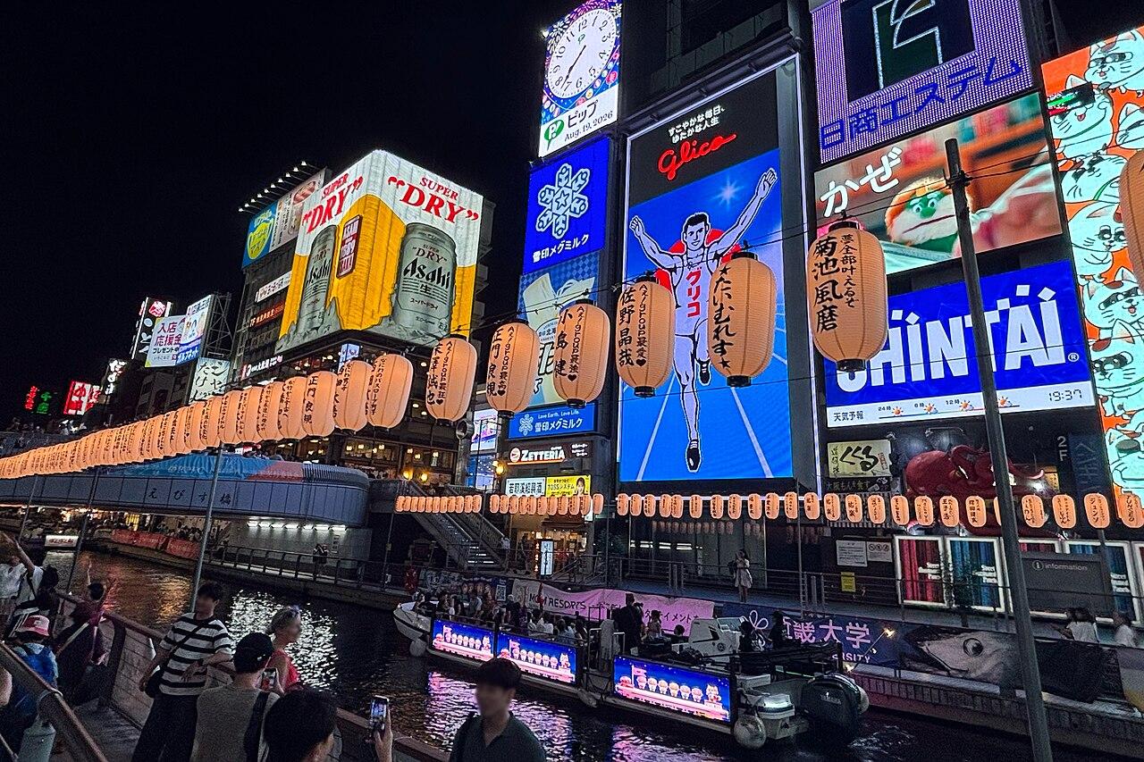 Neon signs reflected in the Dotonbori canal in Osaka at night