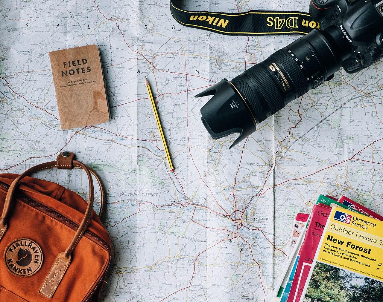 Notebook and pen on a desk, ready for trip planning